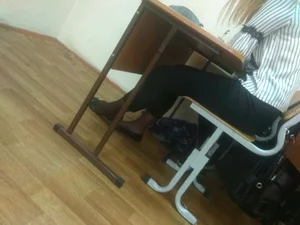 Feet in Flats Closeups of a College Teen Sitting at Her Desk