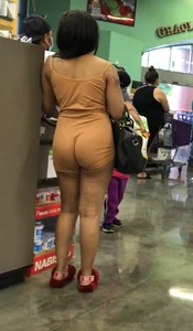 Latina with hard nipples and a big booty in tight spandex shorts outfit