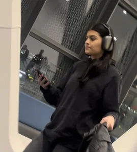 Tight curvy latina at airport pulls up pants
