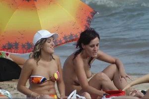 Girls on a nude beach in Sitges, Spain