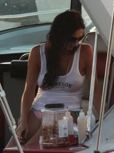 Bikini babe on a boat with a wet see through white shirt showing her tits