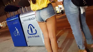 Smoking hot brunette teen in denim shorts showing her ass cheeks