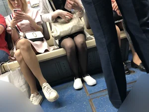 Candid Girl in Sunglasses And Black Pantyhose With Hot Thin Legs Sitting in a Subway Train Creepshots