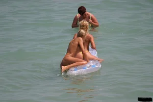Beach voyeur babes in bikinis, thongs and topless