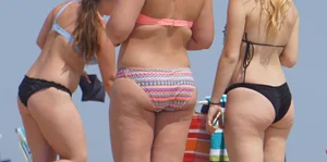 Thick girl on the beach in a bikini