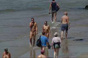 Girls on a nude beach in Sitges, Spain
