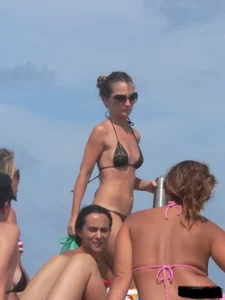 Sexy beach lady in tiny brown thong bikini with a nice ass