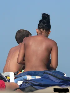 Hot ass topless beach girl with great tits lets her little brother oil up her ass in thong bikini