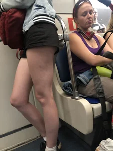 Hot Legs of a Candid Girl in Shorts Standing in a Subway Train Creepshots