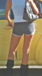 Skinny babe going to her car in little cotton shorts