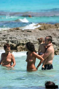 Nude beach ladies in the water showing their tits