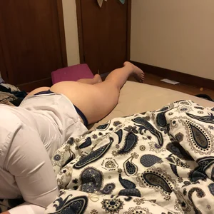 Candind girls, naked or in panties, laying in bed