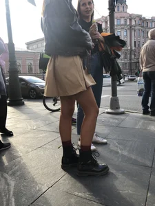 Nice legs, candid girl wearing a skirt and boots