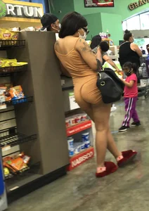 Latina with hard nipples and a big booty in tight spandex shorts outfit