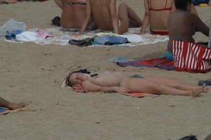Topless girls on a beach in Barcelona