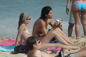 Topless girls on a beach in Barcelona