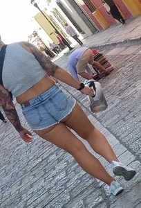 Nice legs and a little peach showing, shorts
