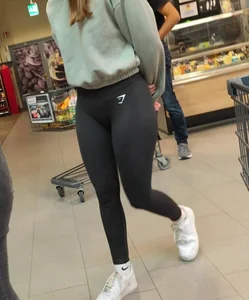 Slim girl with good body in black leggings