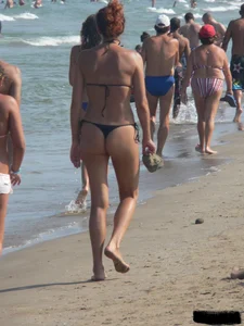 Bunch of sexy babes at the beach in thong bikinis