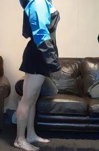 Blonde date with great legs in black miniskirt dressed as delivery girl at Halloween party