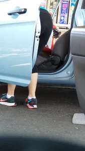 Girl in tight see through leggings with nice ass cleaning her car