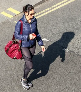 Brunette lady in leggings out walking