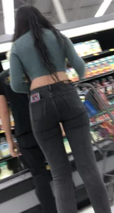 Tight green top and blk jeans at the market