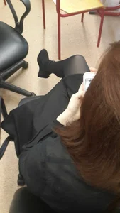 Girl in Black Pantyhose and High Platform Shoes Sitting Cross-Legged in College Classroom Candid