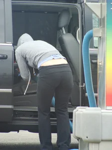 Girls cleaning their cars in jeans and pants
