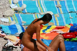 Ula FKK Sexy brunette on a nude beach topless, bottomless and with blue thong