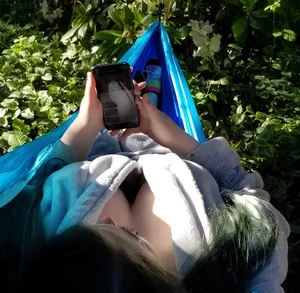 Busty candid girl chilling in a hammoch downblouse creepshot