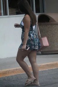 Thick girl in romper shorts going into TJ Maxx gives a cheek peak