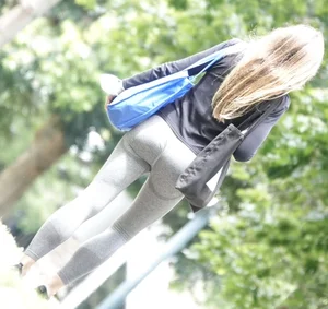Tight bum walking through the park
