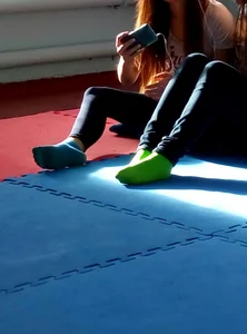 Candid College Girls in Socks and Workout Clothes Sitting on the Floor of the Gymnasium Creepshots