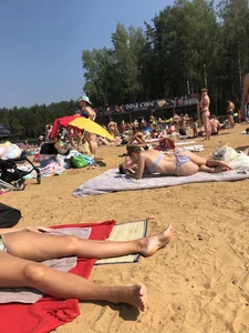 Candid Girl With Perfect Booty in a Hot Swimsuit Lying on a Towel at a Beach Photos