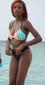 Candid black family, milf and teens on the beach in bikinis