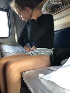 Cute Girl in Mini Shorts and White Socks at the Train Sleeping Car Candid Photos