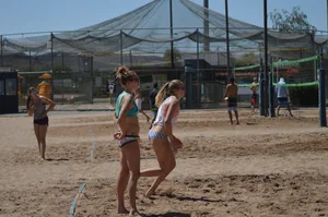 Beach volleyball blonde looking sexy and showing her body off