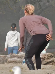 Beach volleyball blonde lady in tight leggings