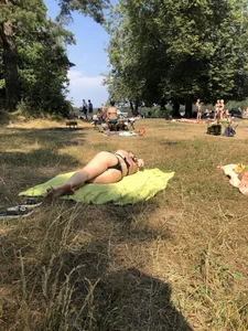 Girl in a Swimsuit Lying on Grass in a Nature Park