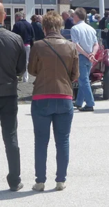 Mature milf's bum in blue jeans street photo