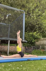 Cute teen gymnast working out