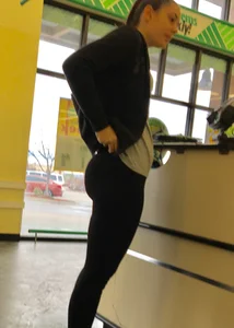 Thick booty girl shopping at Dollar Tree in leggings