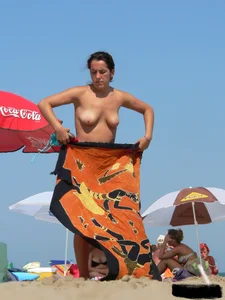 2 topless thonged sexy friends on the beach with great bodies