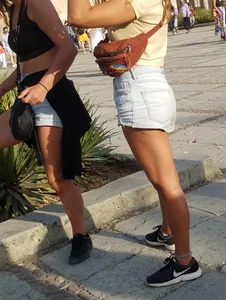 2 girls in short shorts showing legs and a little more part 2