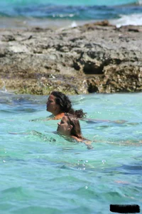 Nude beach ladies in the water showing their tits