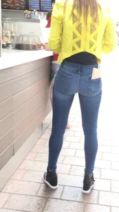 Nice teen ass in tight jeans and long slim legs street cafe creepshot