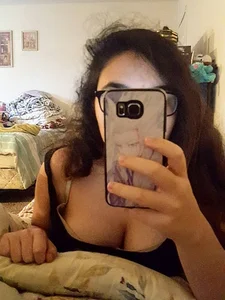 Chubby Bespectacled Girl Taking Selfies in Her Underwear