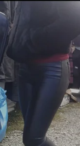 Milf shows off her shapely ass in her leather pants at the market