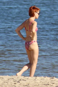 Couple of hot babes hanging out at the beach in bikinis
